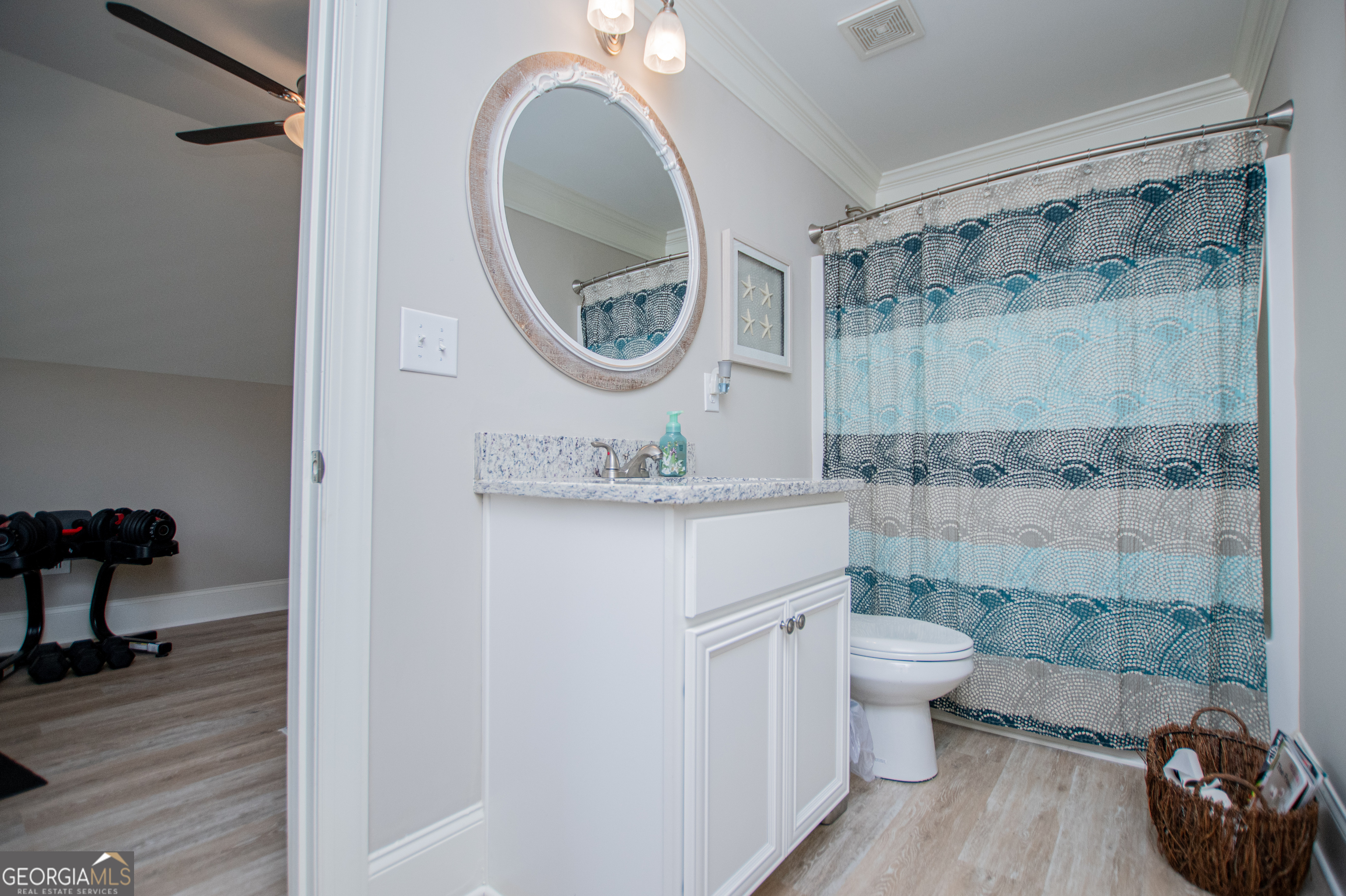 216 Yorkshire Lane Villa Rica, GA 30180 - Photo 62 of 94 a bathroom with a granite countertop toilet a sink and a mirror