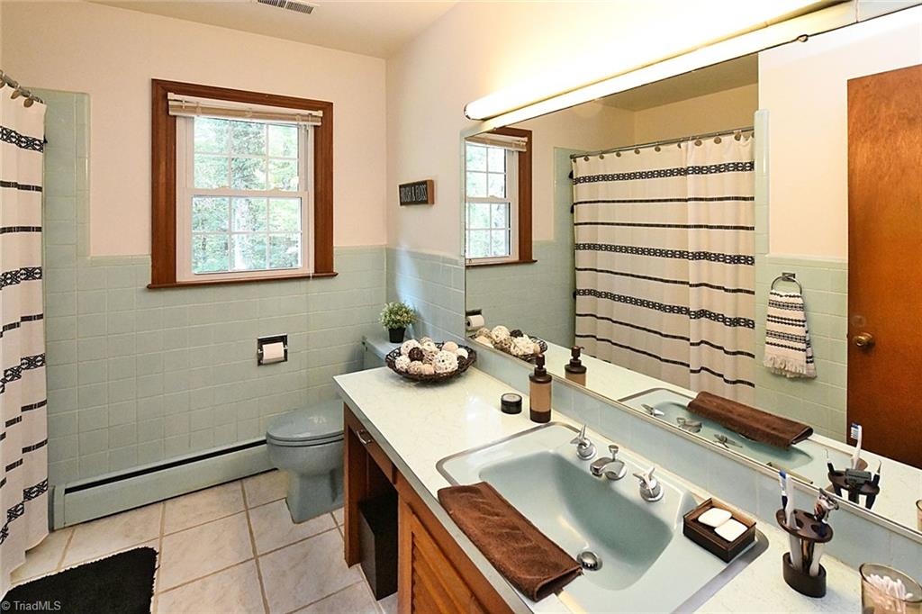 320 Doub Road Lewisville, NC 27023 - Photo 11 of 26 Master bath has a full tile walk-in shower and vanity