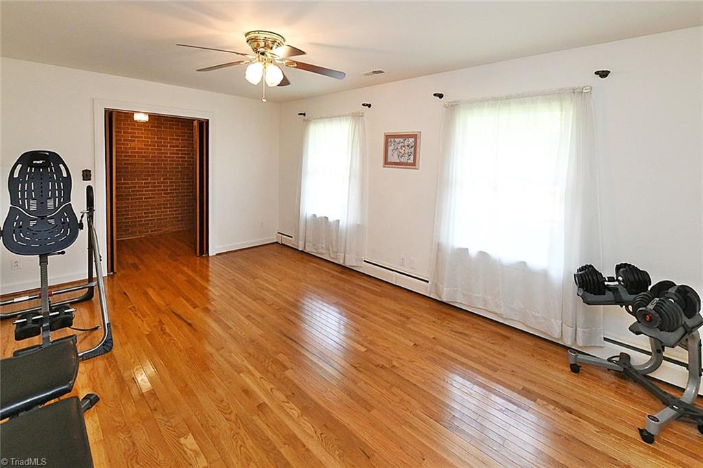 320 Doub Road Lewisville, NC 27023 - Photo 17 of 26 Second photo of living room. Nice smooth ceilings throughout. Brick wall in entry adds chic character and charm