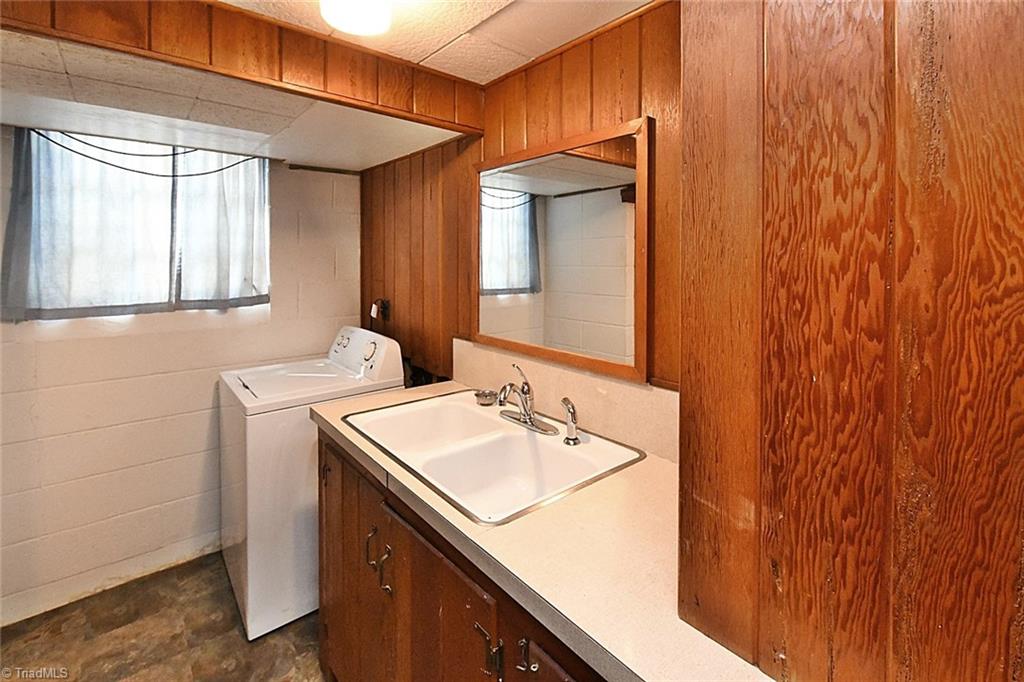 320 Doub Road Lewisville, NC 27023 - Photo 18 of 26 Full laundry and bath combination downstairs. Washer and Dryer stay! Per seller, he checked into having a washer/dryer added in upstairs garage and was told this could be done for a possible location also on the main level