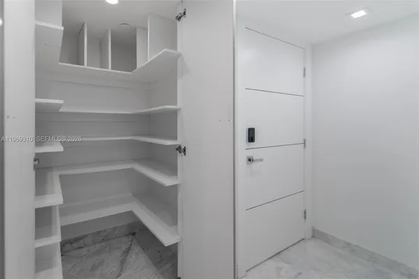 a spacious bathroom with a double vanity sink mirror and toilet