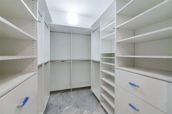 a view of an empty walk in closet