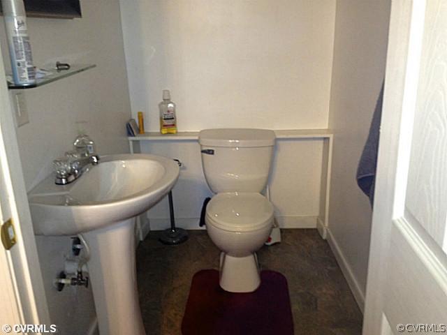 1108 Decatur Street Richmond, VA 23224 - Photo 9 of 24 a bathroom with a toilet sink and mirror
