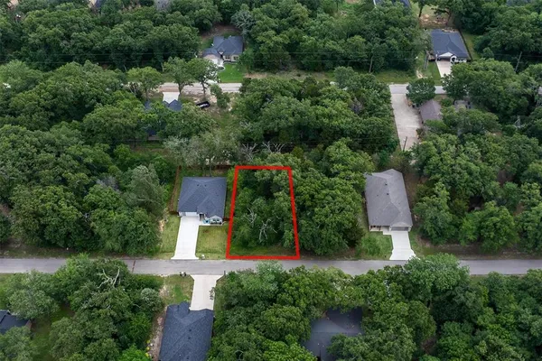 an aerial view of a house with a garden