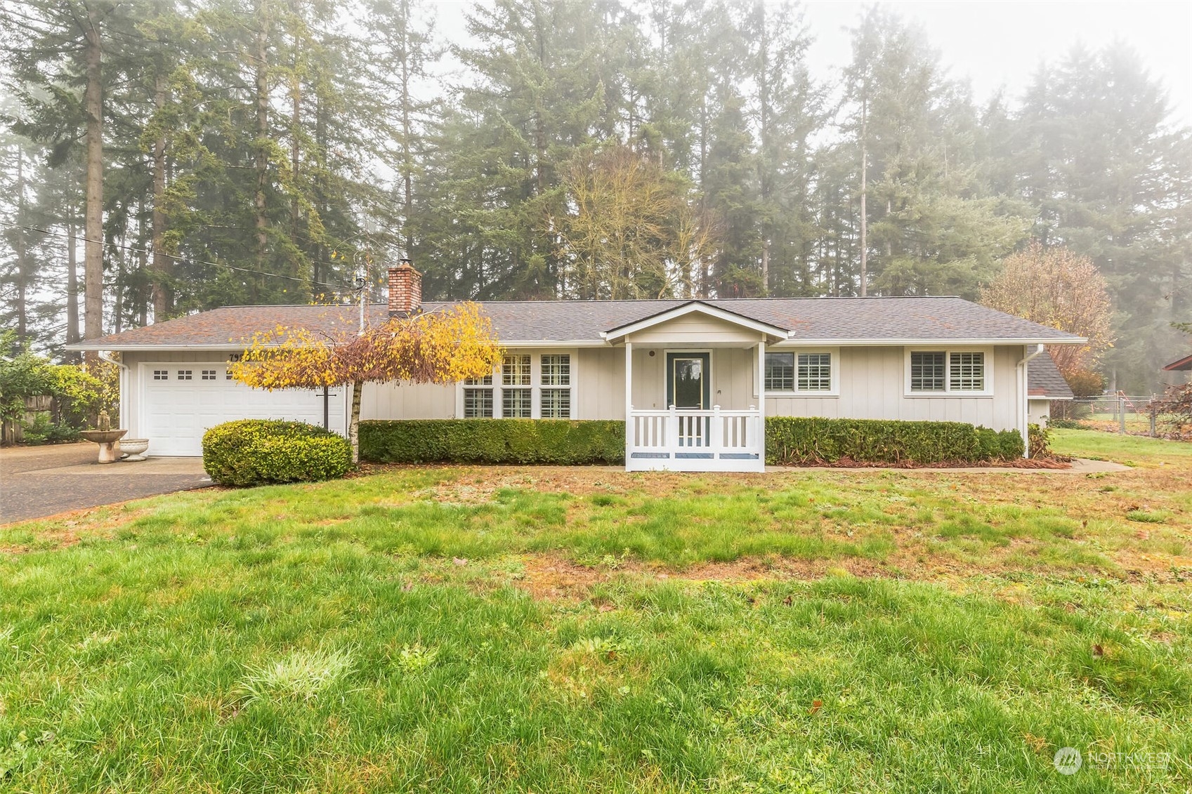 7920 187th Avenue Southwest Rochester, WA 98579 - Photo 2 of 28 a front view of a house with a yard and trees