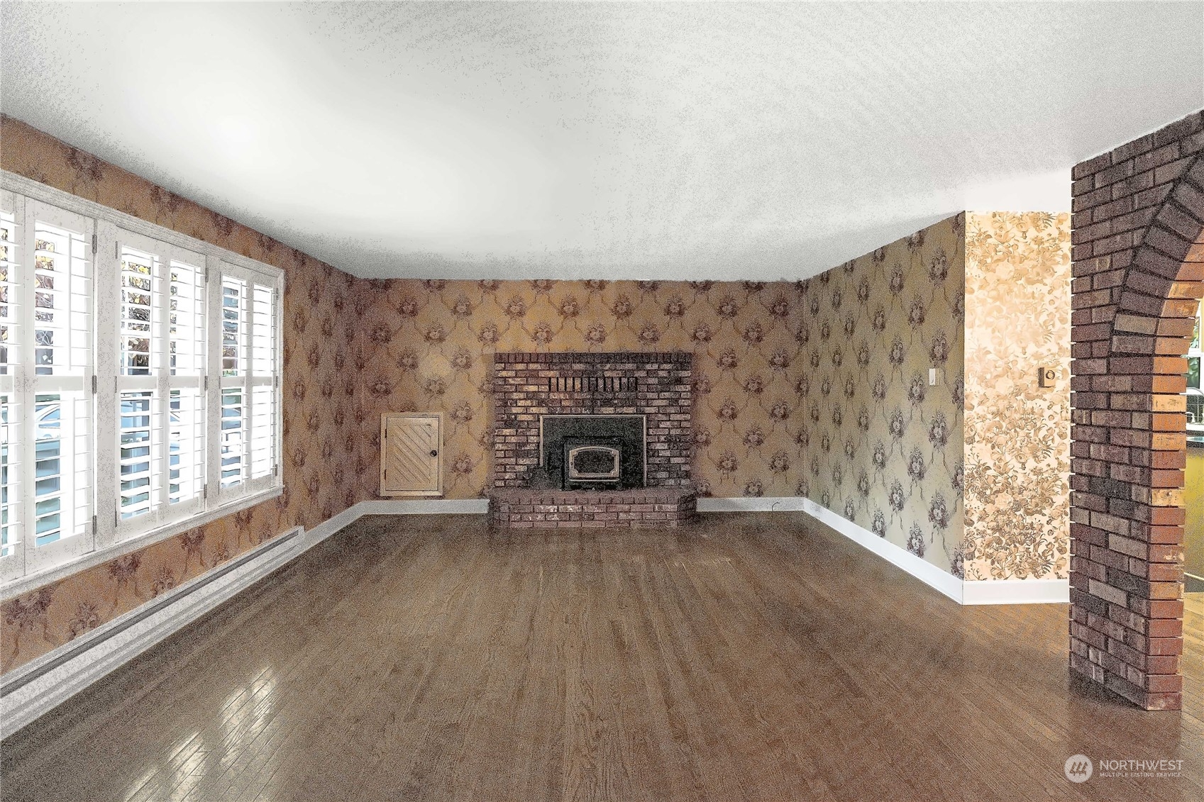 7920 187th Avenue Southwest Rochester, WA 98579 - Photo 3 of 28 a view of an empty room with a fireplace and a window