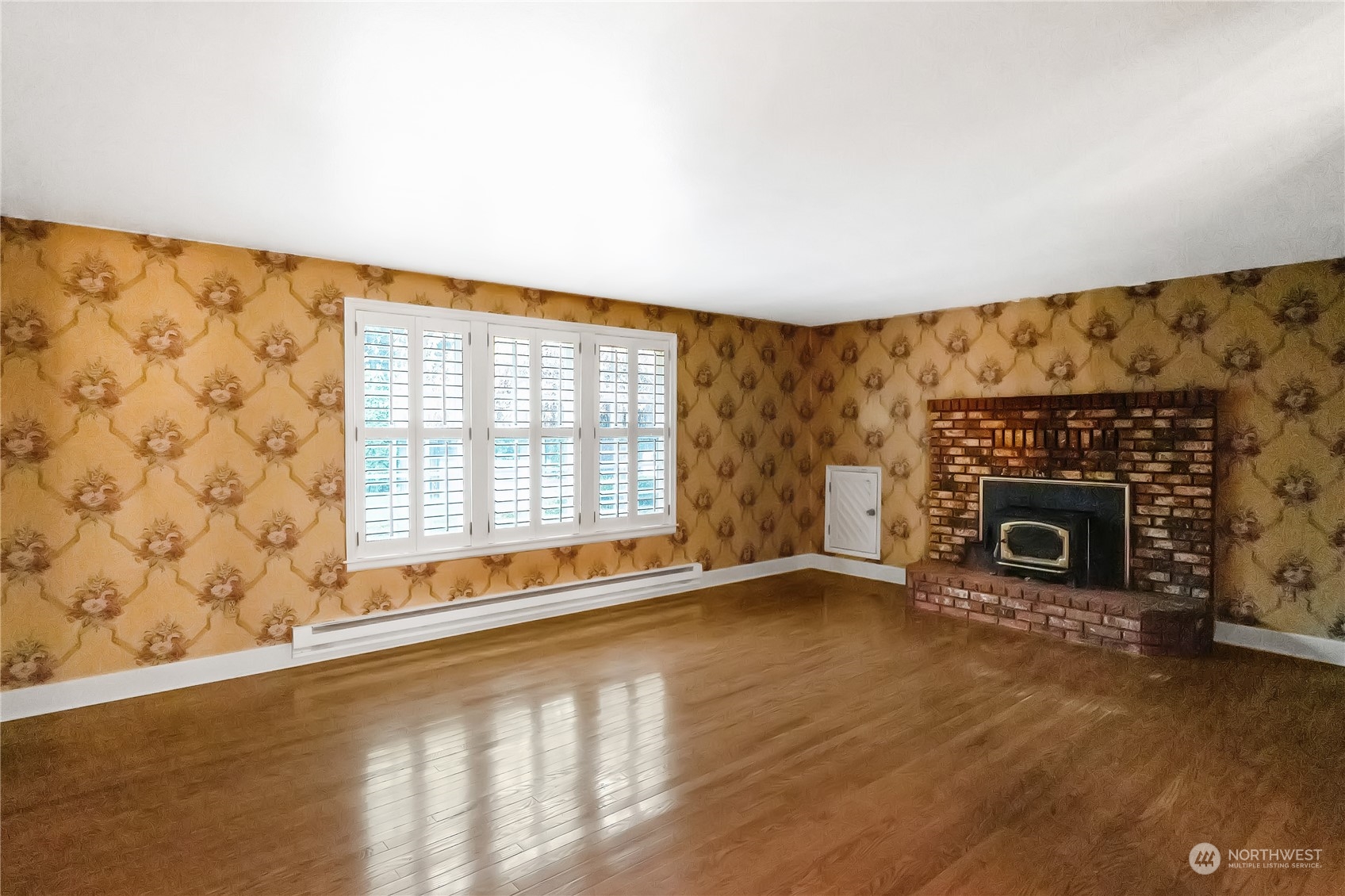 7920 187th Avenue Southwest Rochester, WA 98579 - Photo 5 of 28 a view of an empty room with a fireplace and a window