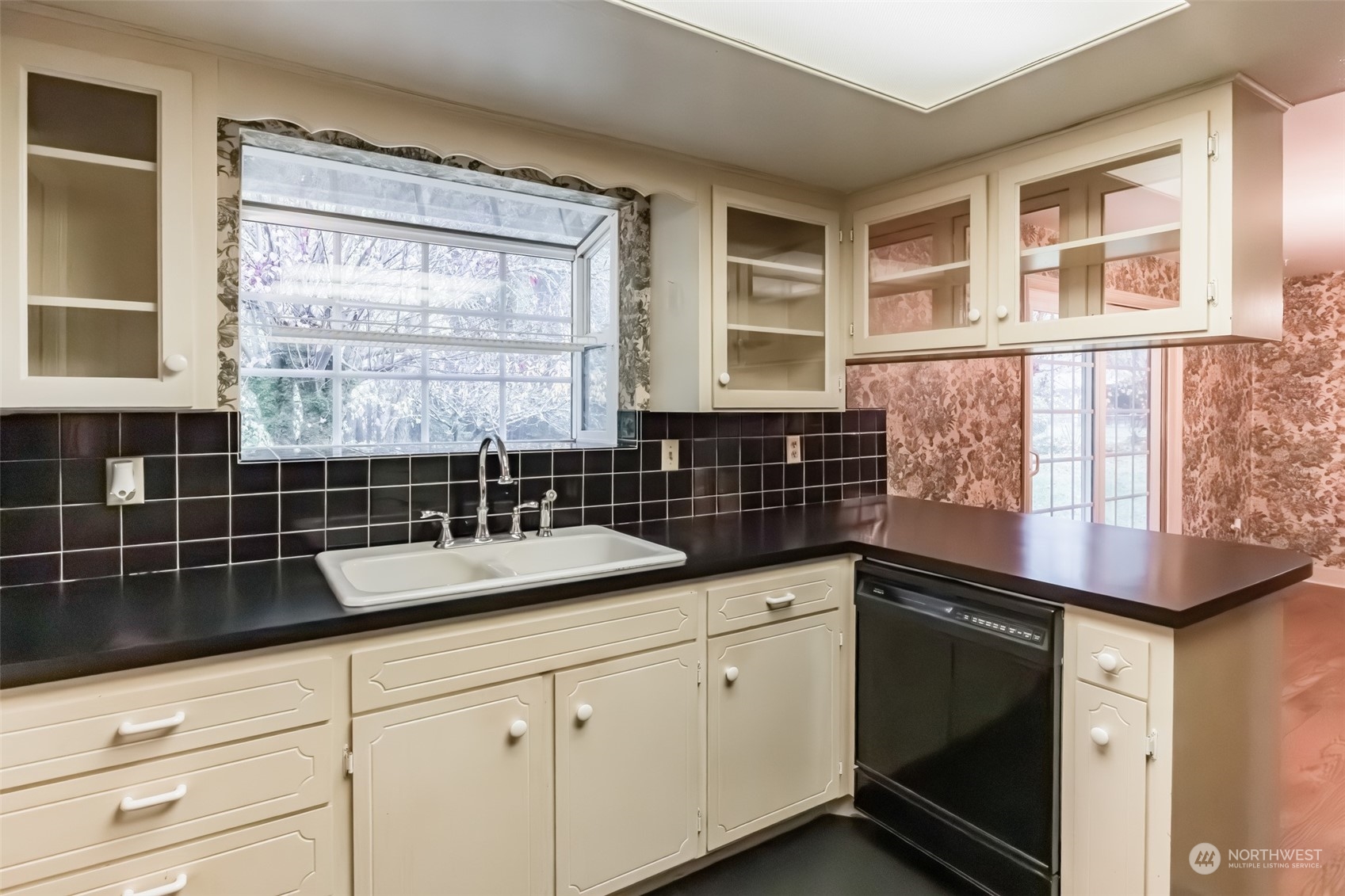 7920 187th Avenue Southwest Rochester, WA 98579 - Photo 9 of 28 a kitchen with granite countertop a sink and a stove
