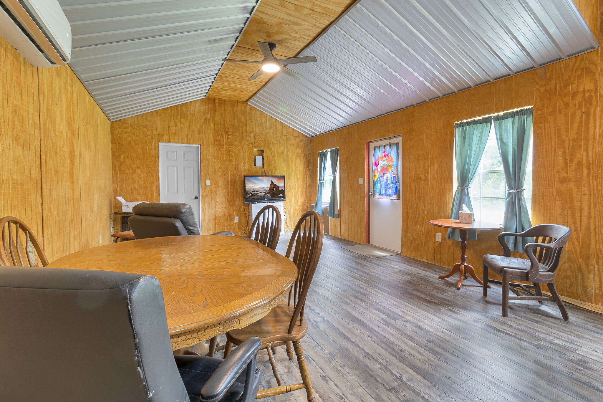 300 Collier Road Point Blank, TX 77364 - Photo 11 of 49 a dining room with furniture and wooden floor