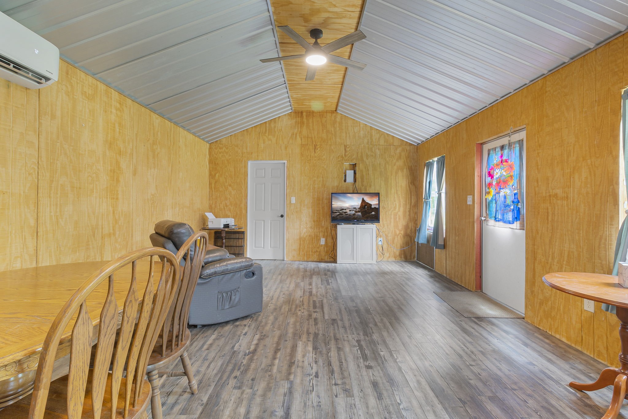 300 Collier Road Point Blank, TX 77364 - Photo 12 of 49 a spacious bedroom with a bed and wooden floor