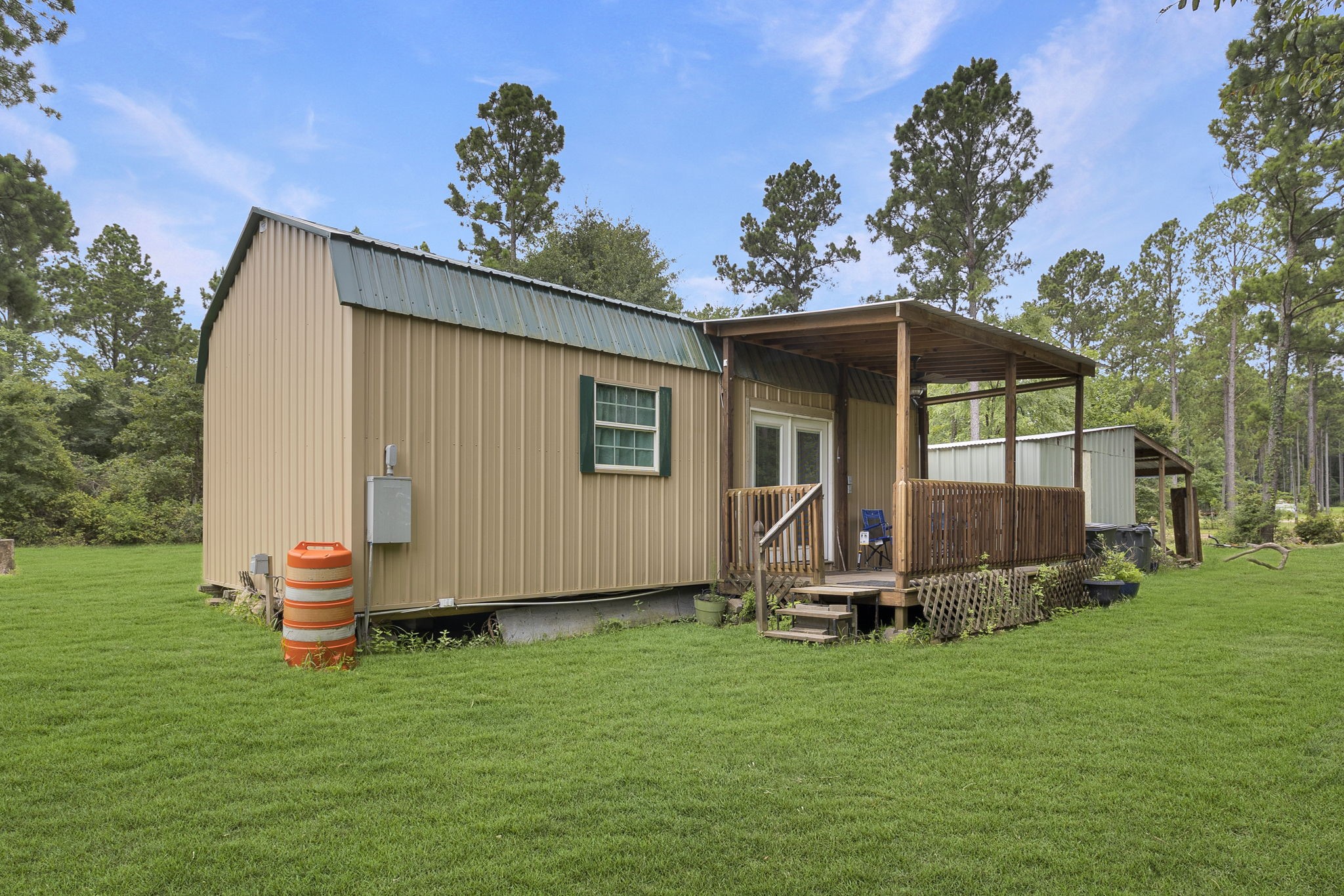 300 Collier Road Point Blank, TX 77364 - Photo 16 of 49 a front view of a house with garden