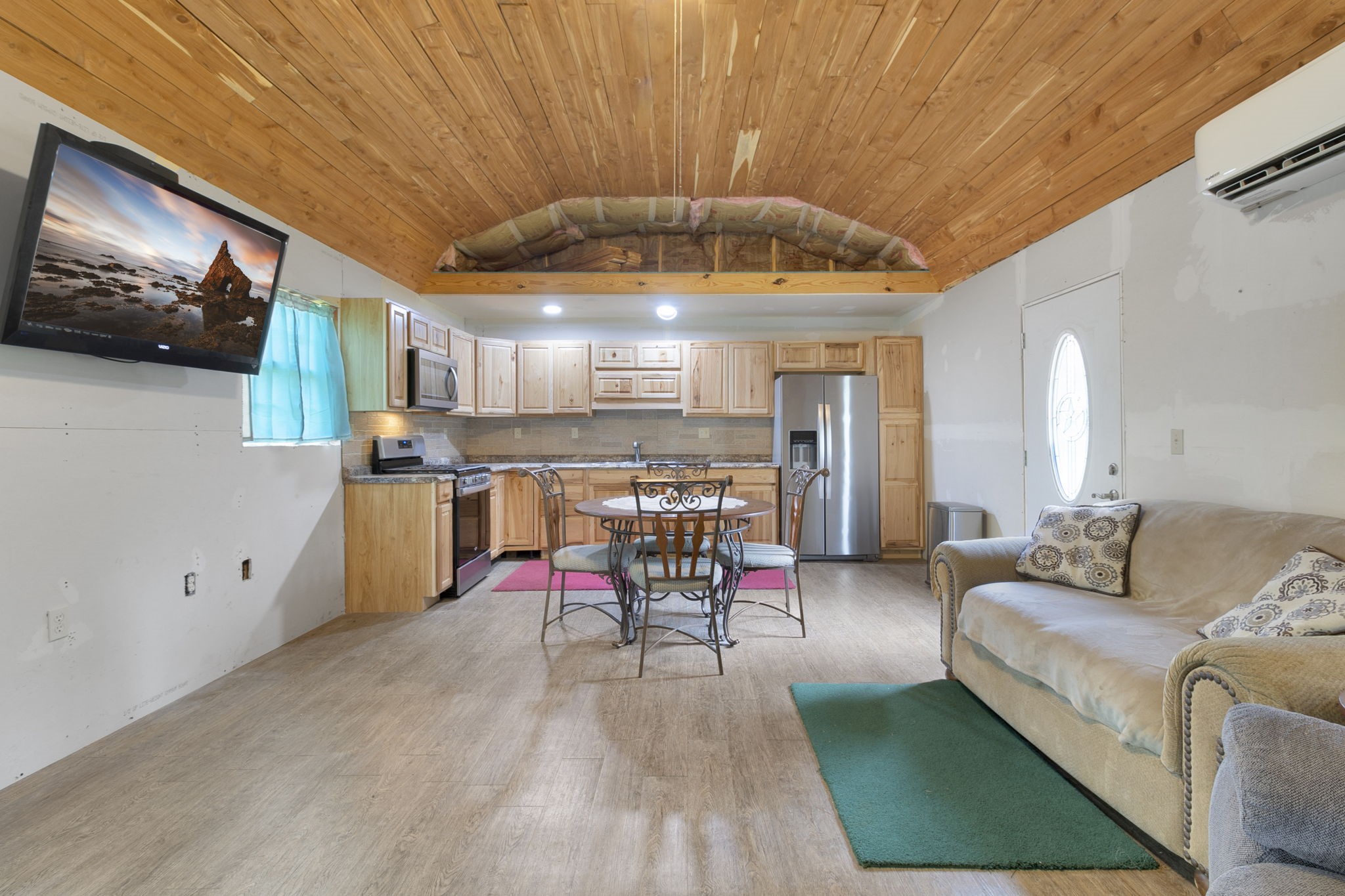 300 Collier Road Point Blank, TX 77364 - Photo 24 of 49 a living room with furniture and a flat screen tv