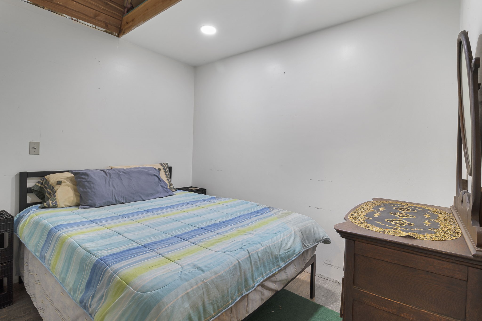 300 Collier Road Point Blank, TX 77364 - Photo 26 of 49 a bedroom with a bed and dresser