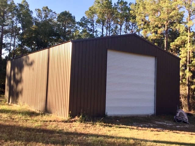 300 Collier Road Point Blank, TX 77364 - Photo 27 of 49 a view of a house with a yard