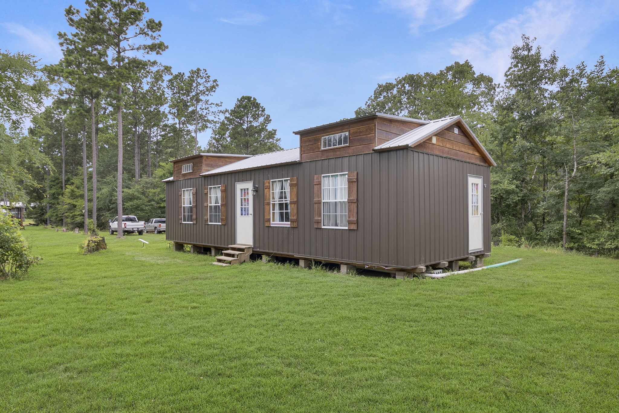 300 Collier Road Point Blank, TX 77364 - Photo 3 of 49 a view of a house with a yard