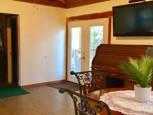 300 Collier Road Point Blank, TX 77364 - Photo 46 of 49 a bedroom with a bed and a flat screen tv