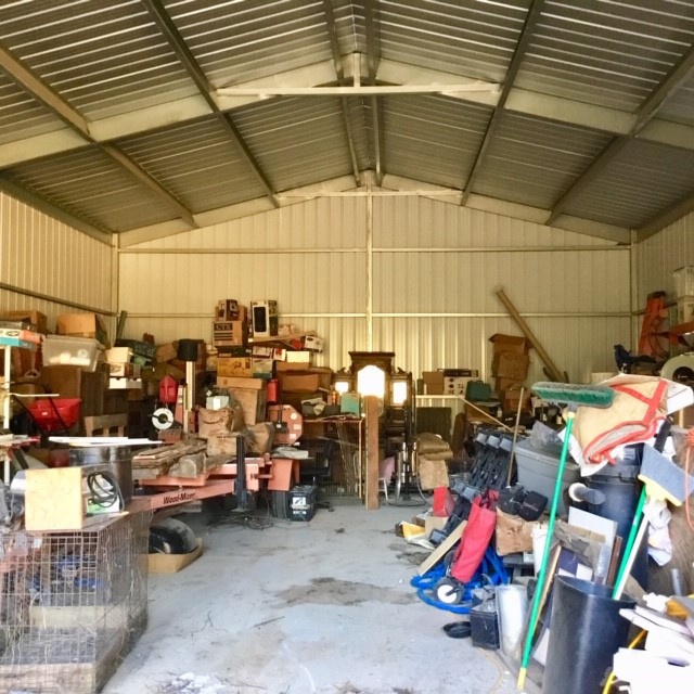 300 Collier Road Point Blank, TX 77364 - Photo 48 of 49 a view of a garage with a table and chairs