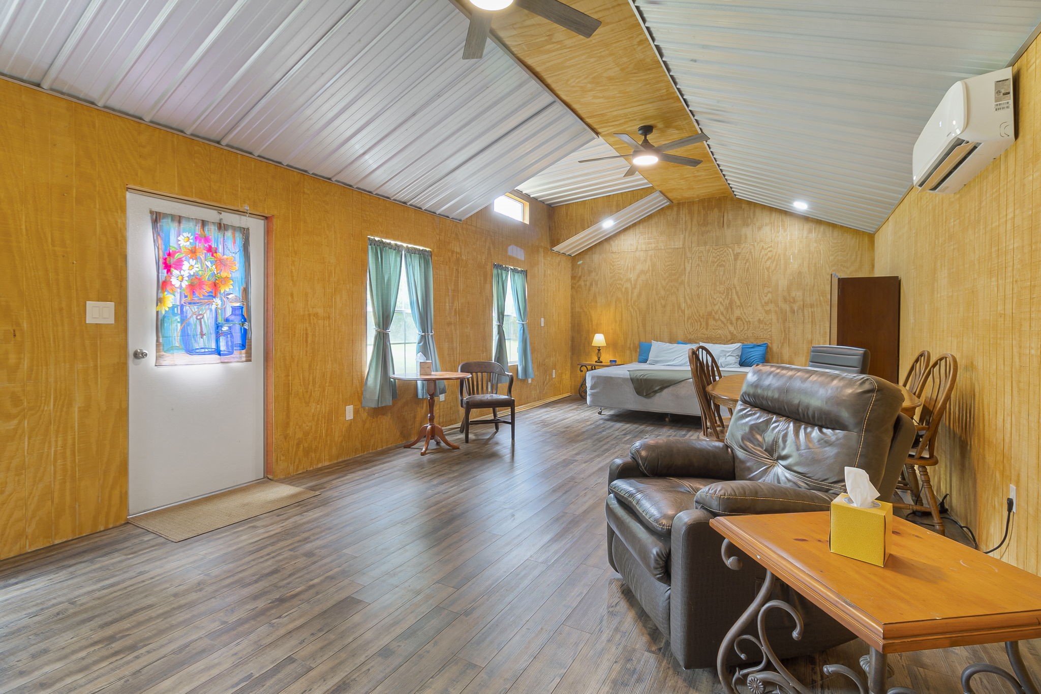 300 Collier Road Point Blank, TX 77364 - Photo 9 of 49 a living room with furniture and a flat screen tv
