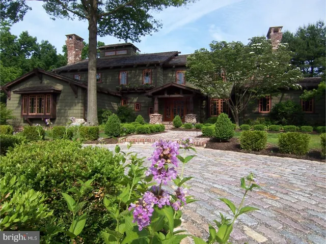 a view of a house with a tree