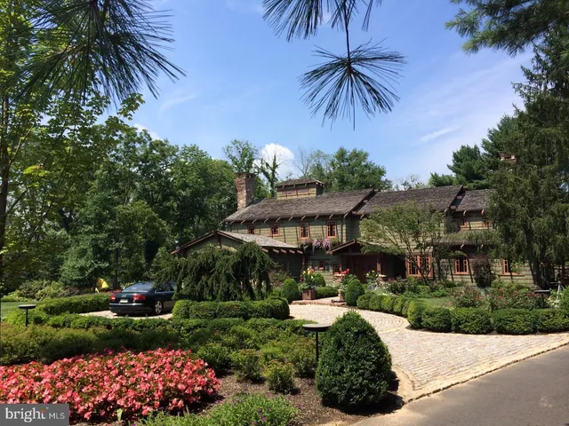a view of a wooden bench next to a yard