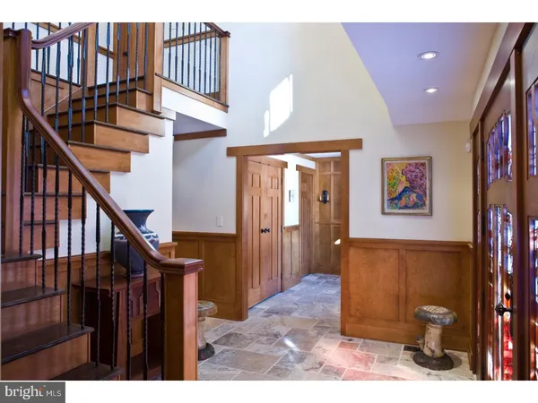 a kitchen with kitchen island granite countertop a sink stainless steel appliances and cabinets