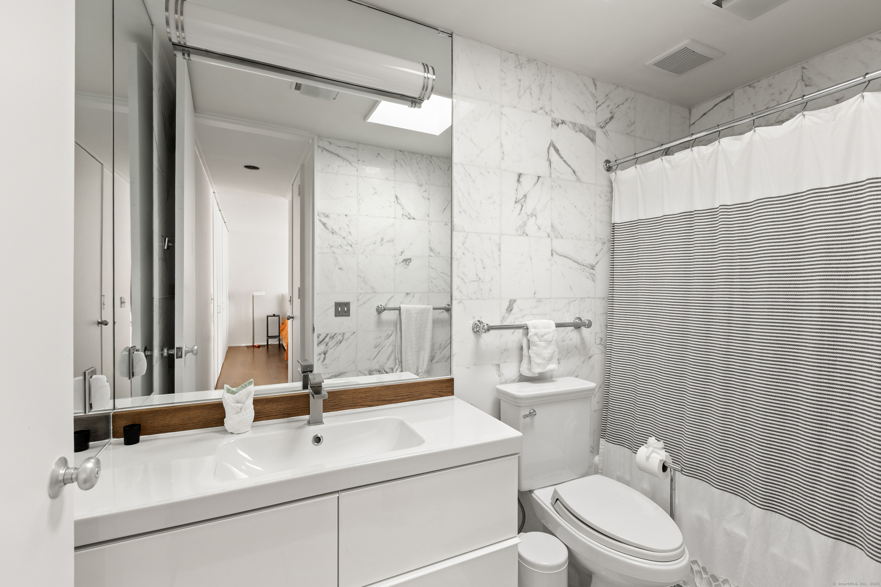 26 Chalburn Road Redding, CT 06896 - Photo 17 of 27 a bathroom with a sink a toilet and shower