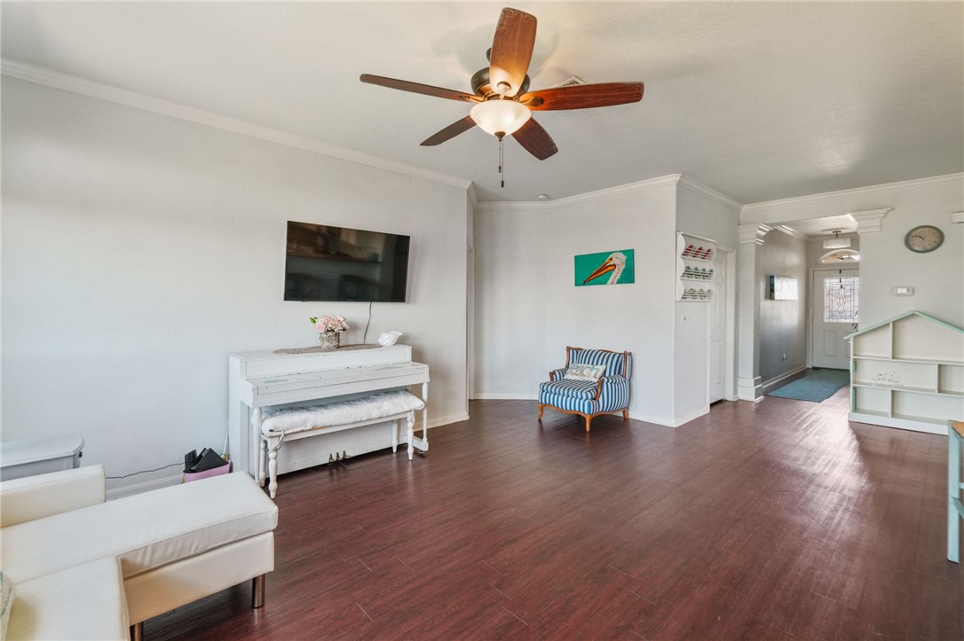 1000 Imperial Street Portland, TX 78374 - Photo 14 of 26 a bedroom with furniture and a flat screen tv