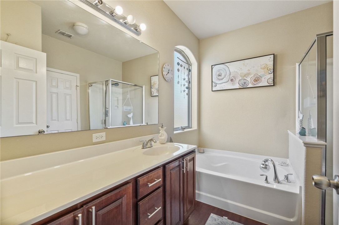 1000 Imperial Street Portland, TX 78374 - Photo 18 of 26 a bathroom with a tub sink and mirror