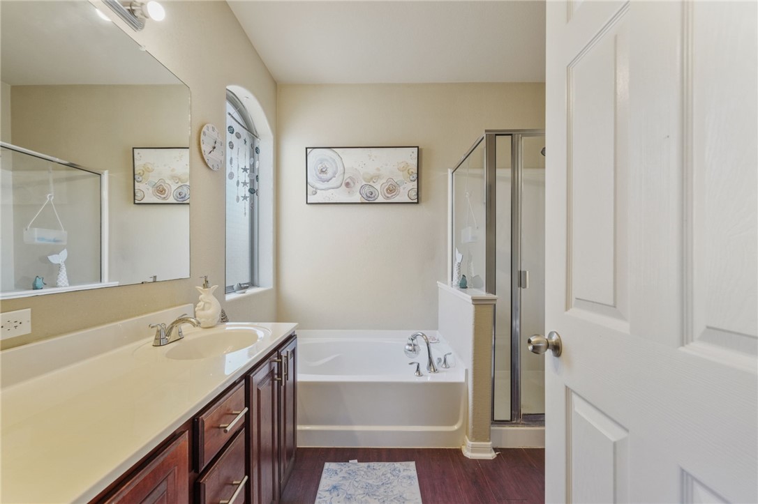 1000 Imperial Street Portland, TX 78374 - Photo 19 of 26 a bathroom with a tub sink and mirror