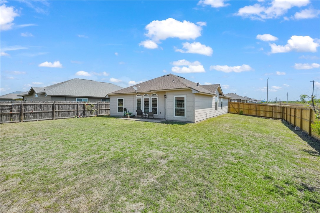 1000 Imperial Street Portland, TX 78374 - Photo 24 of 26 a outdoor view of a house with a backyard