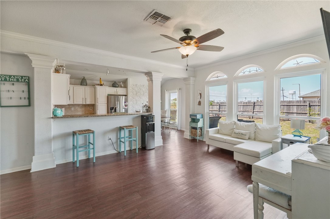 1000 Imperial Street Portland, TX 78374 - Photo 9 of 26 a living room with furniture kitchen view and a wooden floor