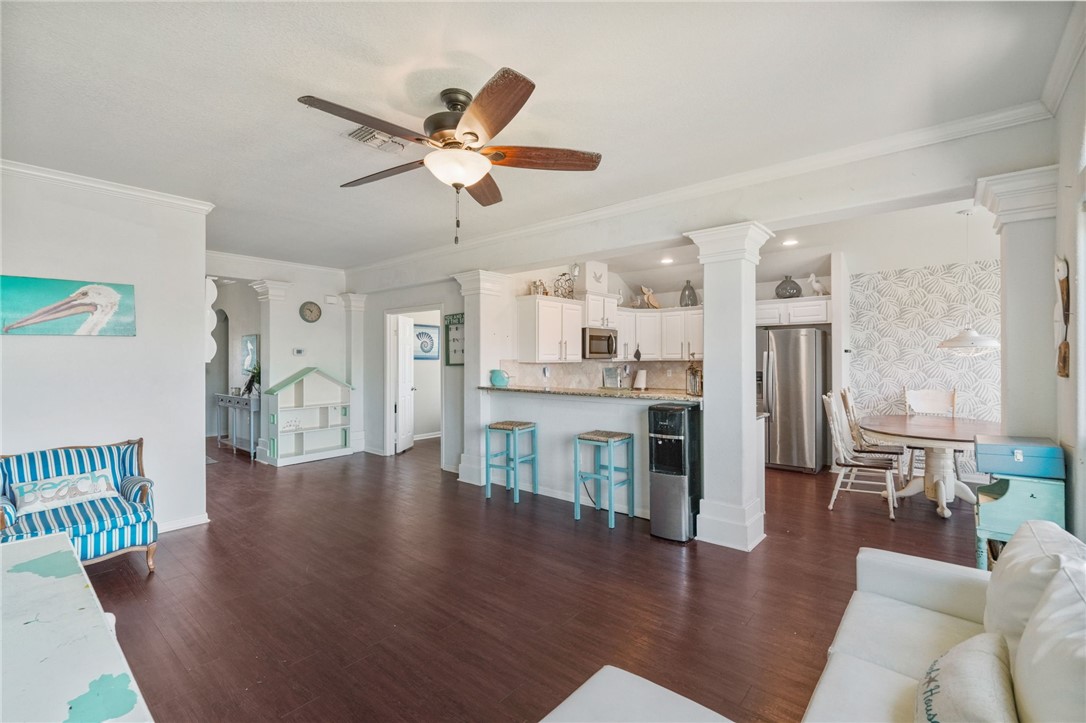 1000 Imperial Street Portland, TX 78374 - Photo 10 of 26 a living room with couches and kitchen view with wooden floor
