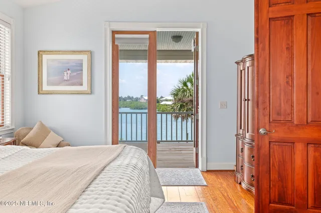 a spacious bathroom with a granite countertop sink a mirror and a shower