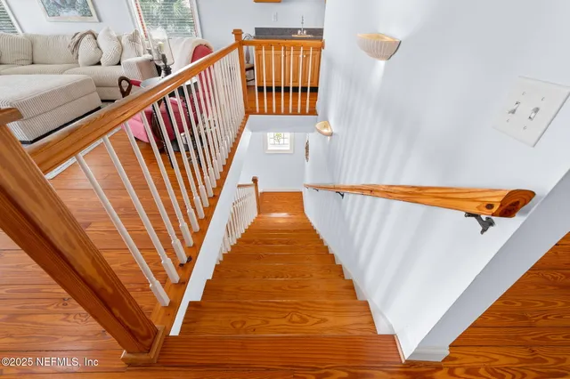 a view of a swimming pool with a yard and plants