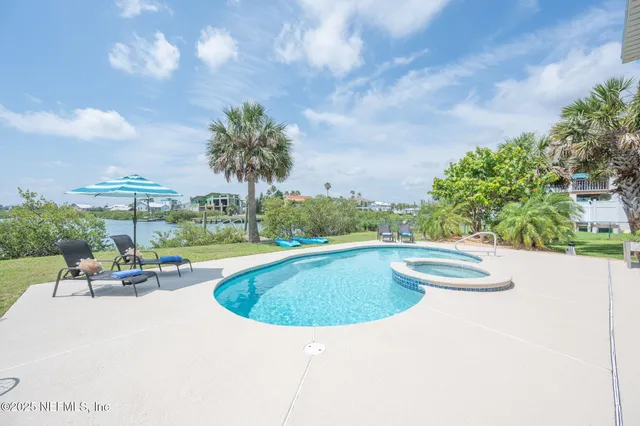 a view of swimming pool with seating space