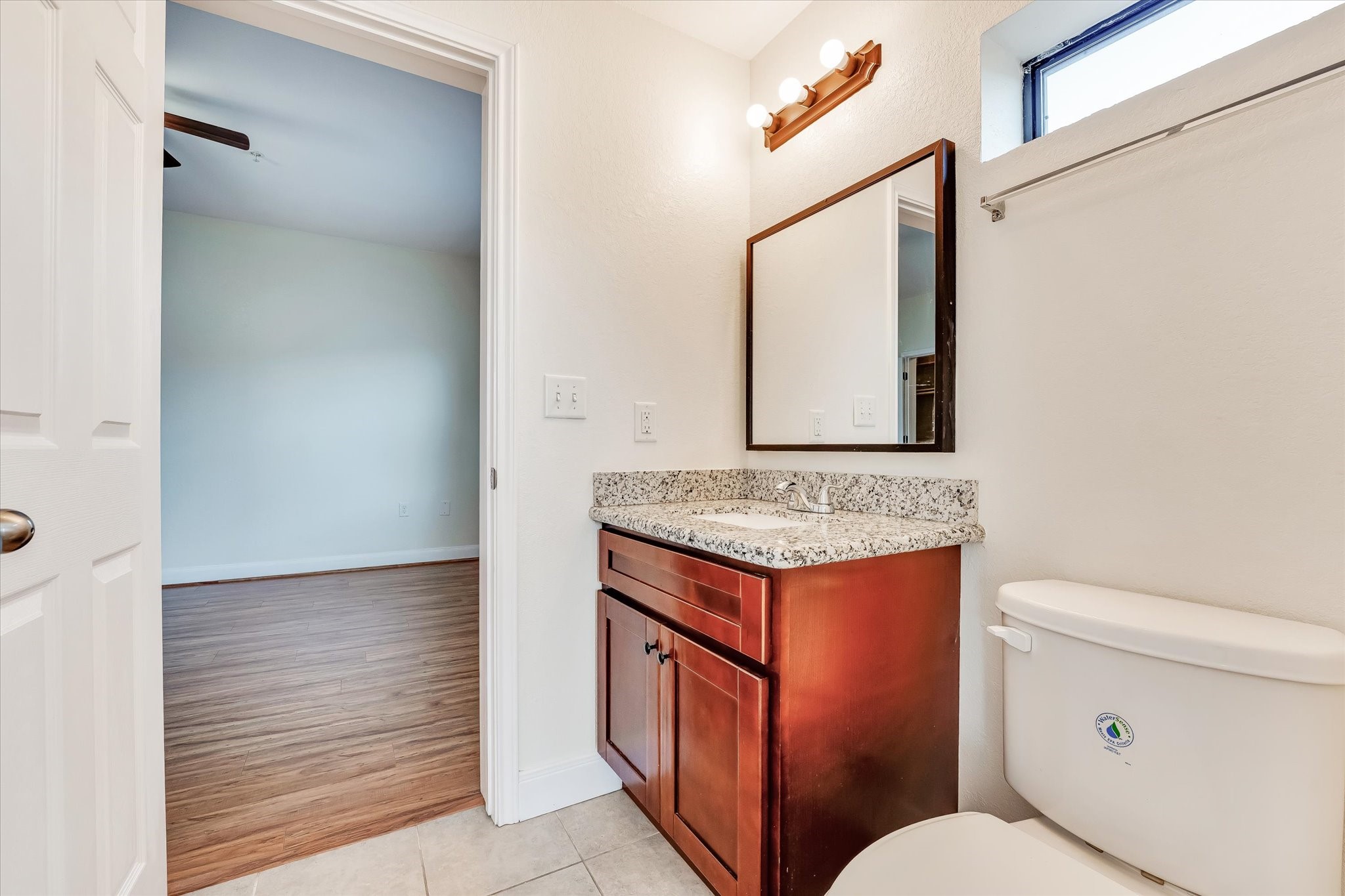10102 Neuens Road, Unit B300 Houston, TX 77080 - Photo 11 of 18 a view of bathroom with a toilet sink and mirror