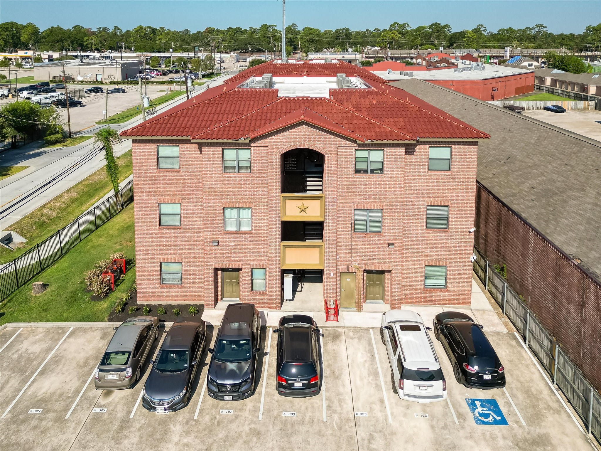 10102 Neuens Road, Unit B300 Houston, TX 77080 - Photo 14 of 18 an aerial view of a house with garden space and parking