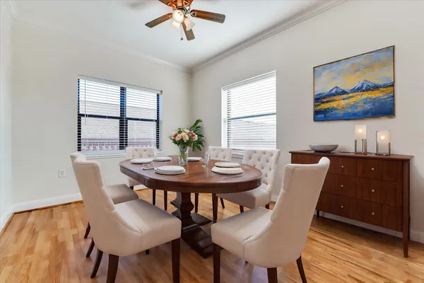 a view of a dining room with furniture window and wooden floor