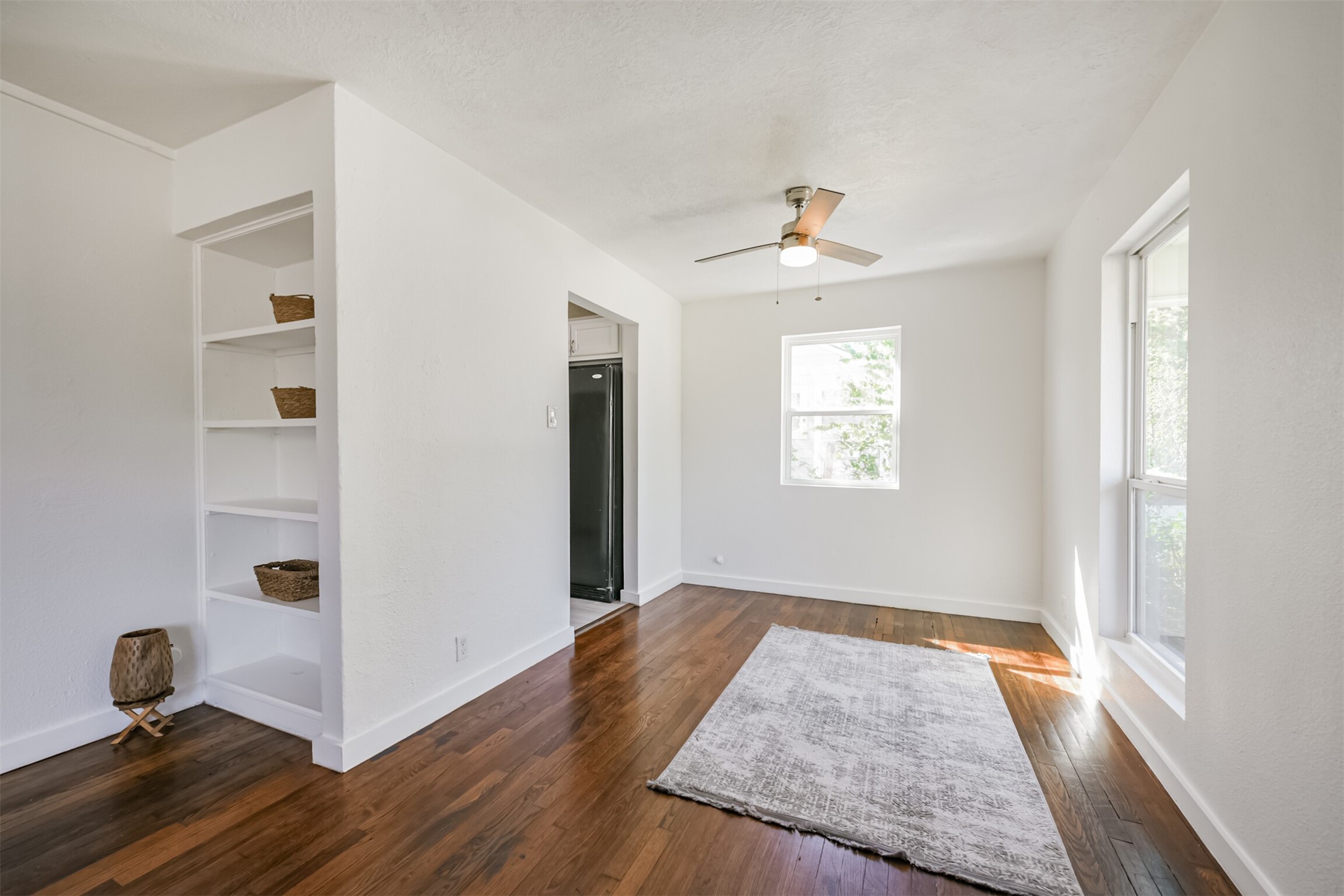 7546 Greendowns Street Houston, TX 77087 - Photo 10 of 33 wooden floor in an empty room with a window