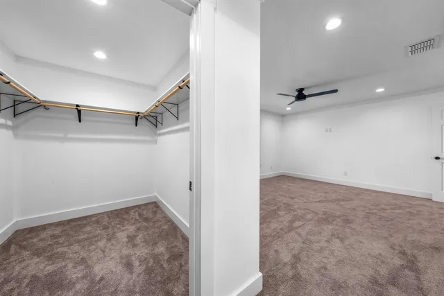 a view of a room with a wardrobe space