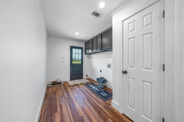a view of entryway with wooden floor