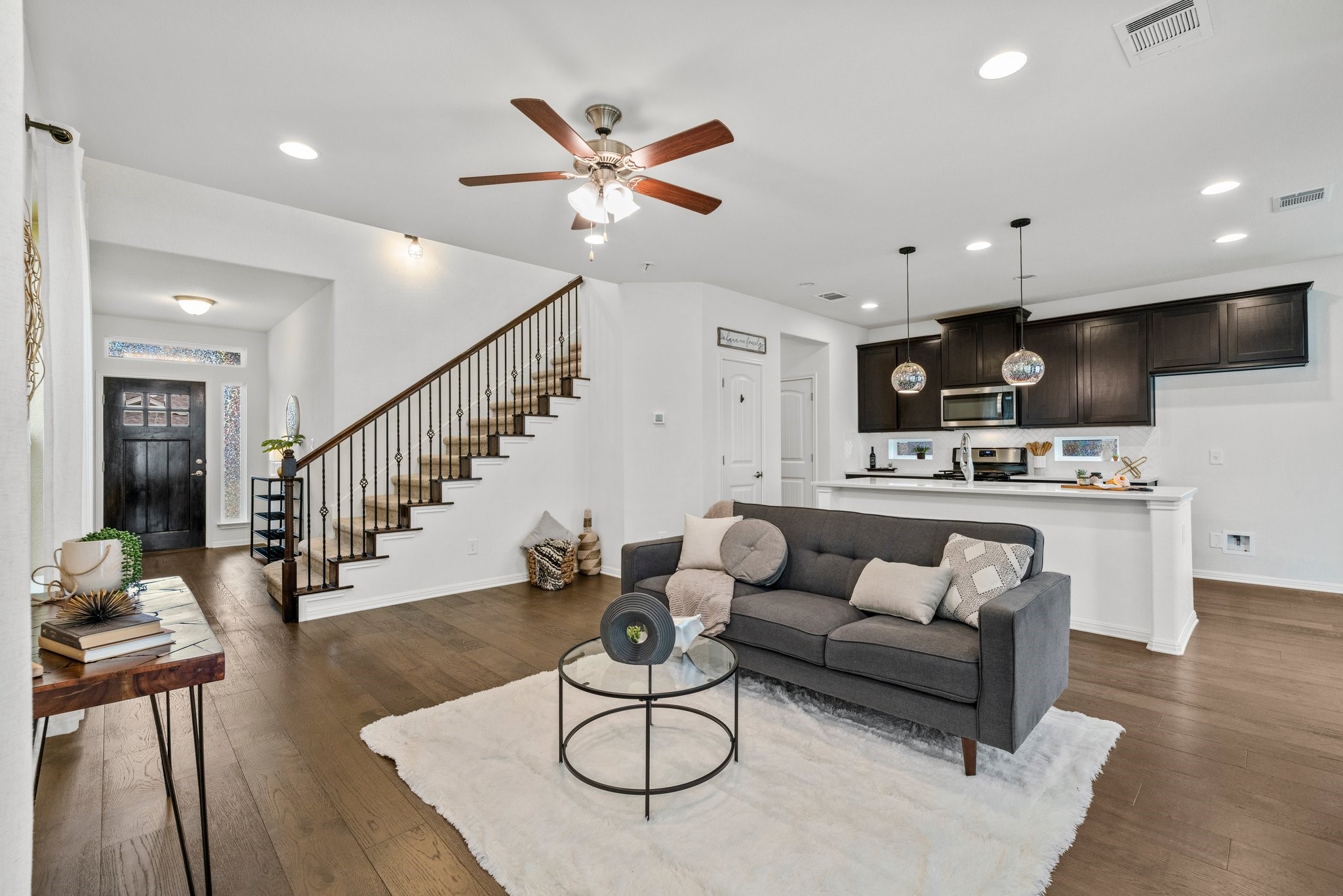 142 Simon Kyle, TX 78640 - Photo 1 of 1 Recessed lighting throughout the main level enhances the bright aesthetic on the main level.
