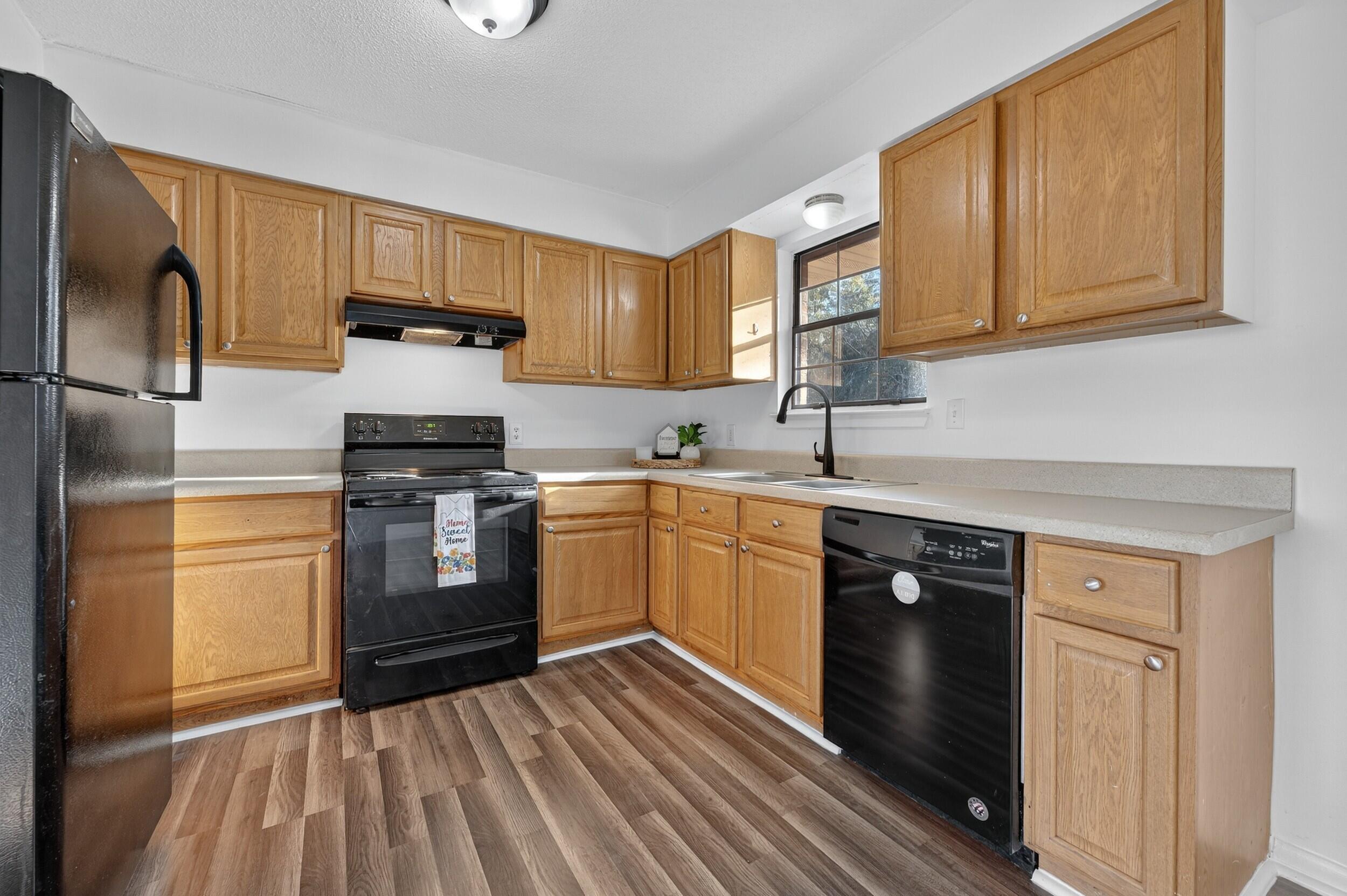 552 Roberts Drive DeFuniak Springs, FL 32433 - Photo 11 of 40 a kitchen with a sink stove and refrigerator