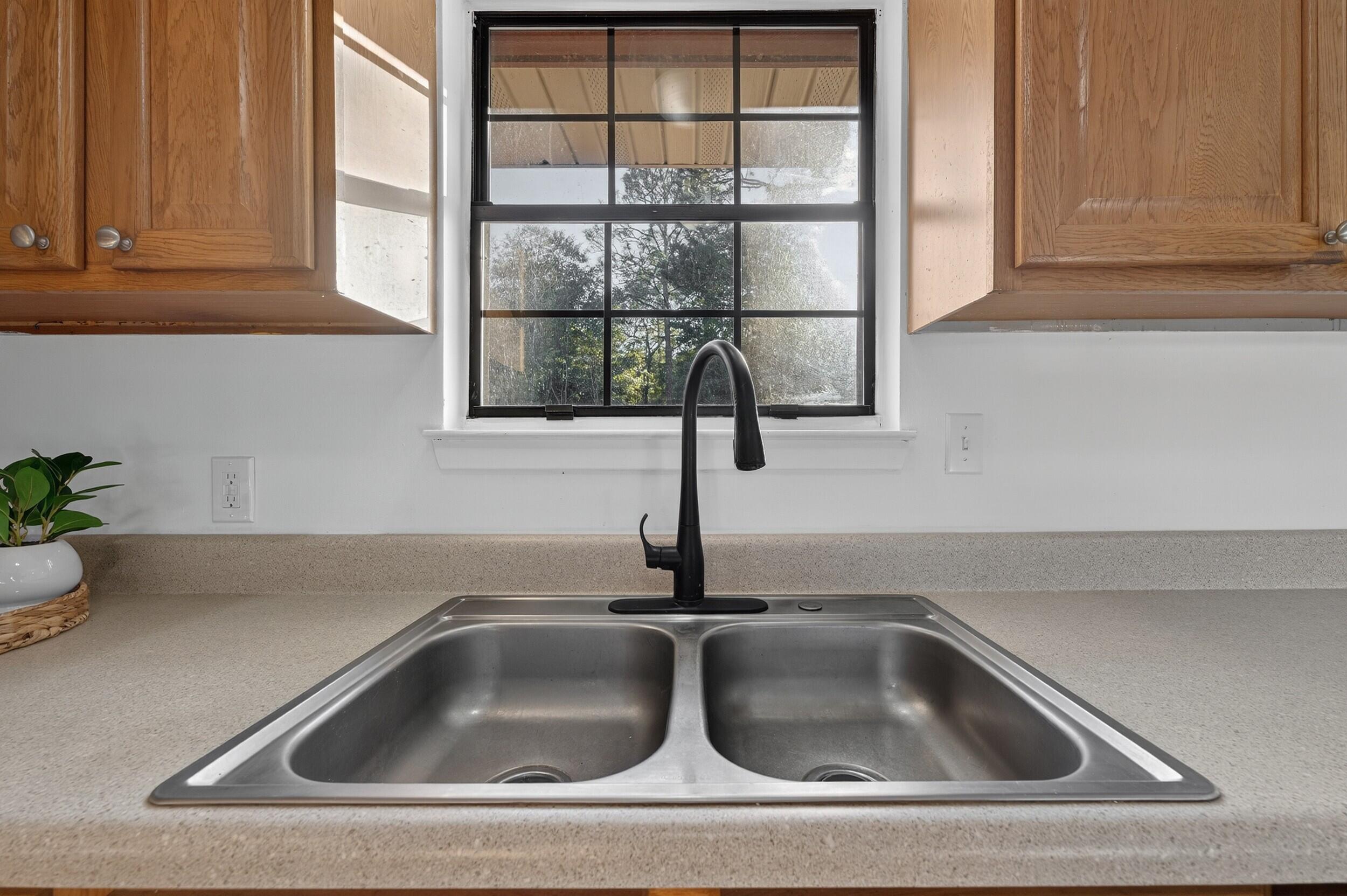 552 Roberts Drive DeFuniak Springs, FL 32433 - Photo 16 of 40 a close view of sink and tap