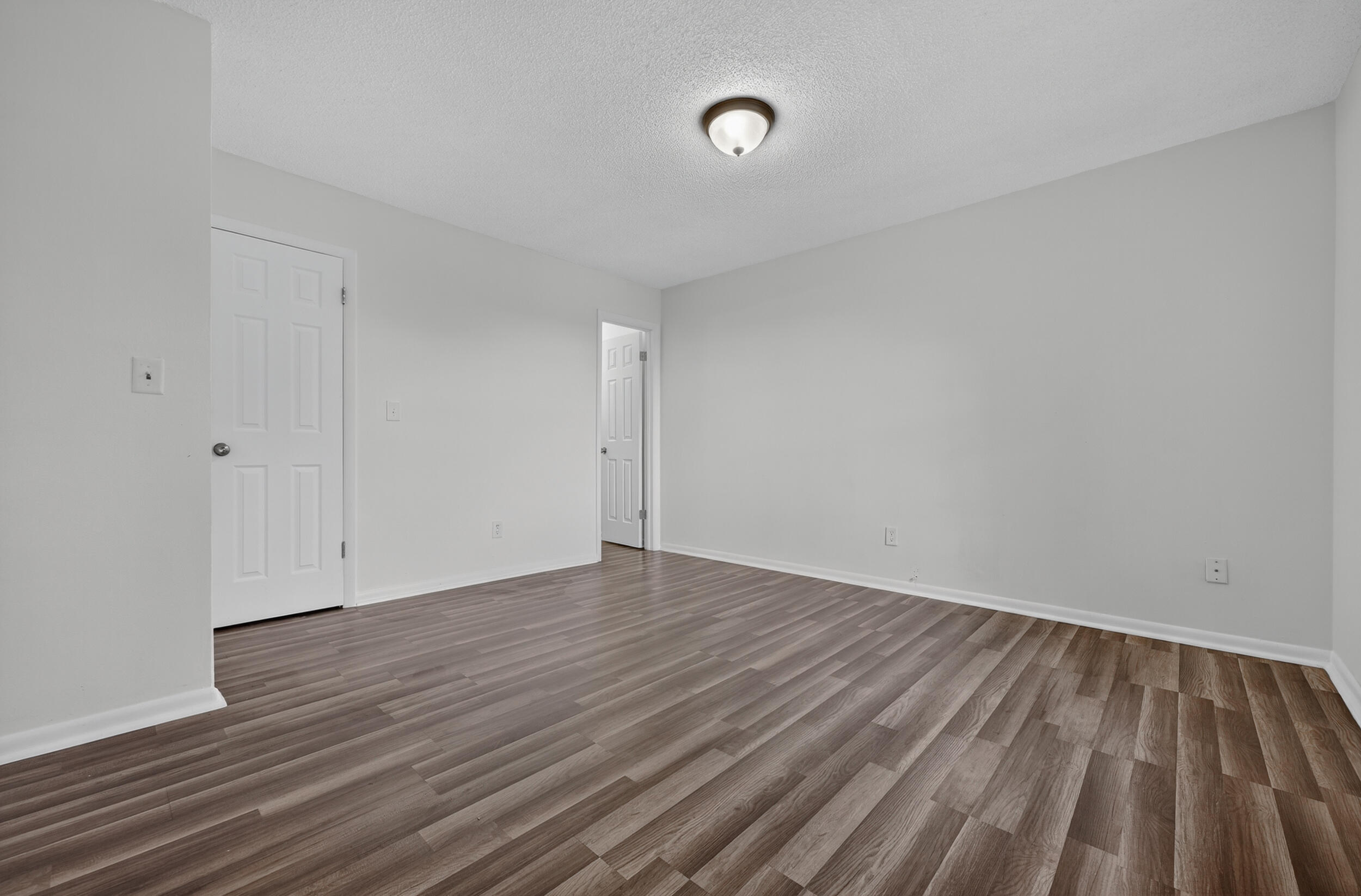 552 Roberts Drive DeFuniak Springs, FL 32433 - Photo 24 of 40 a view of an empty room with wooden floor