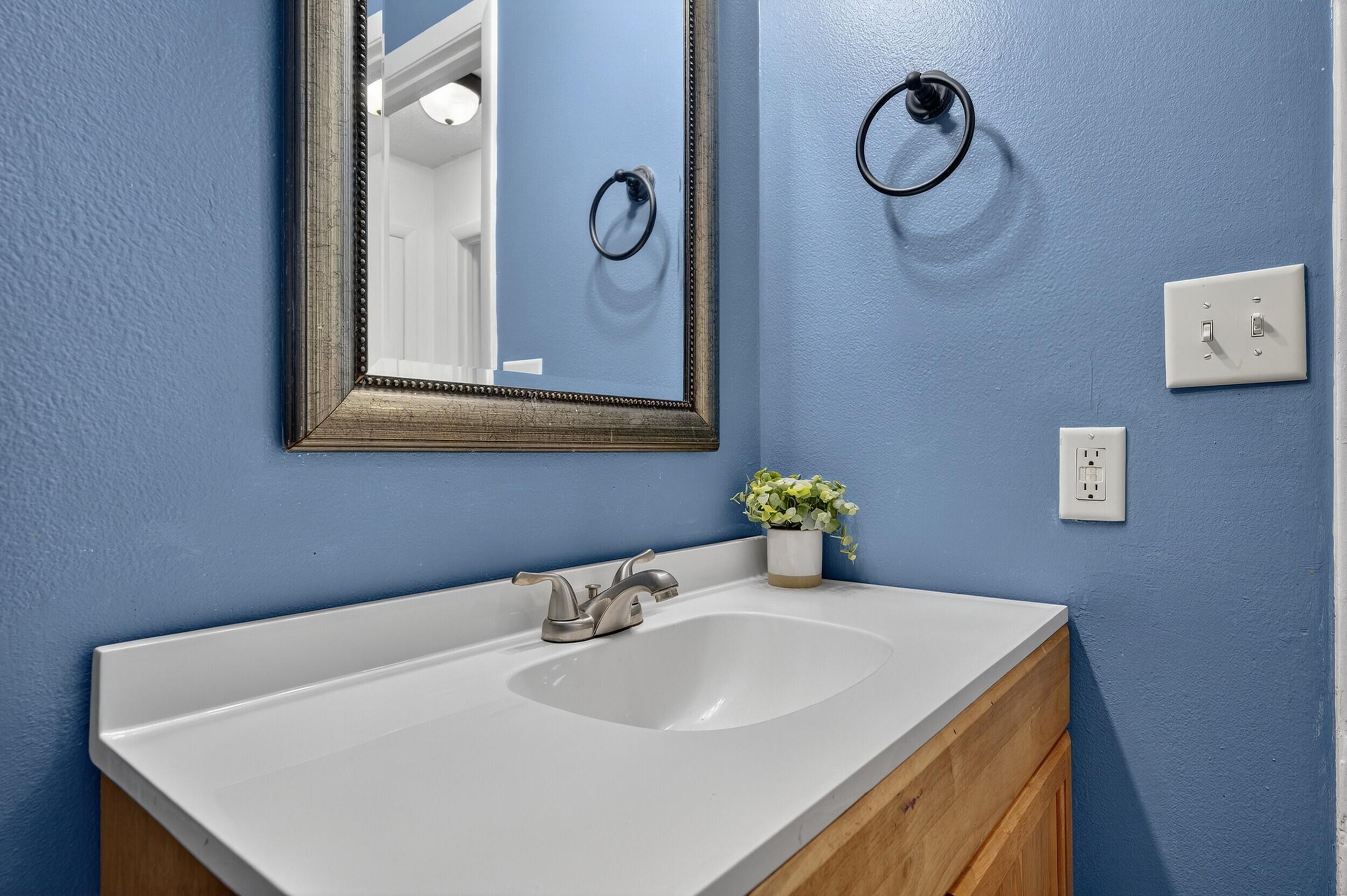 552 Roberts Drive DeFuniak Springs, FL 32433 - Photo 30 of 40 a bathroom with a sink and a mirror