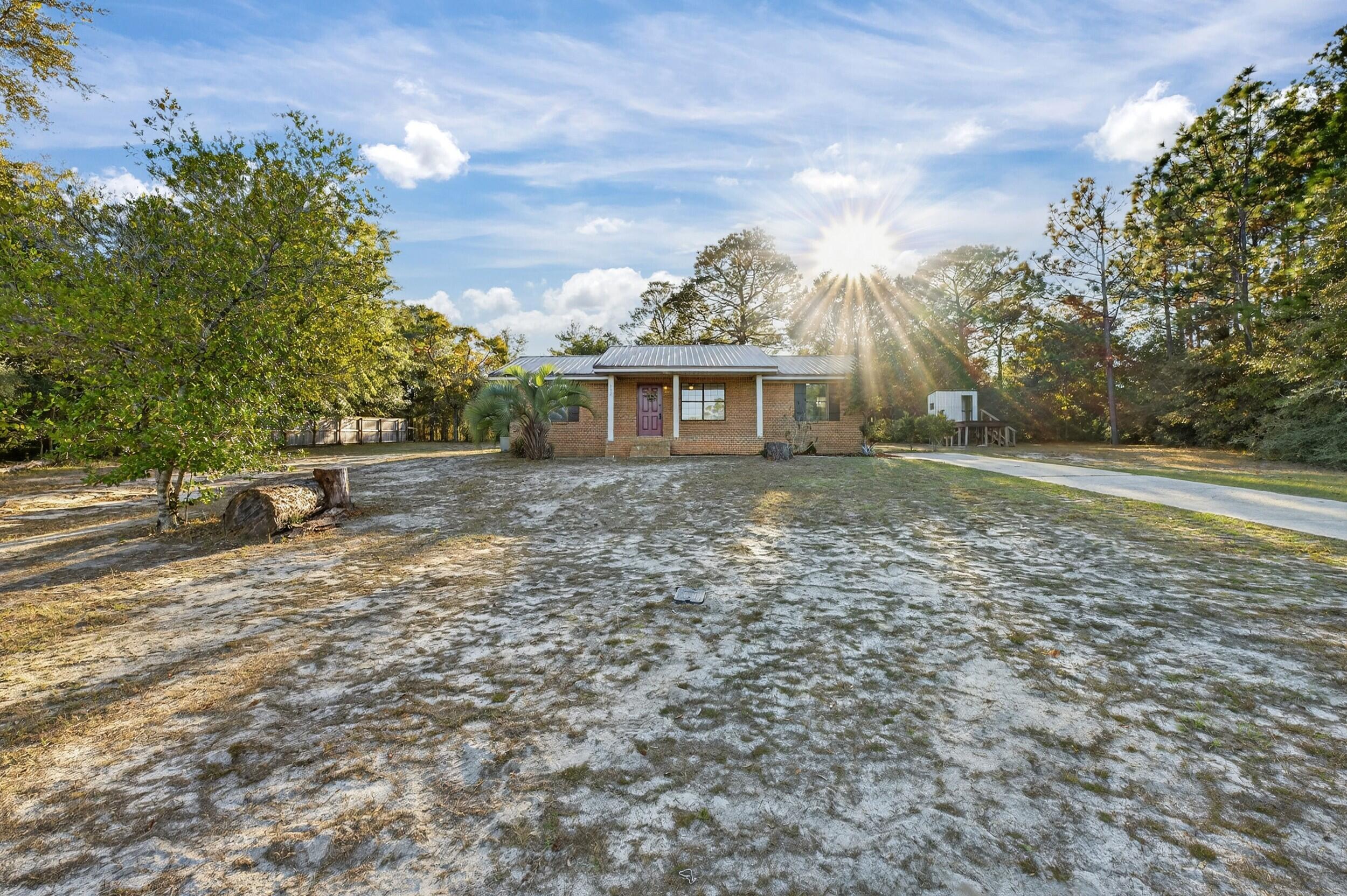 552 Roberts Drive DeFuniak Springs, FL 32433 - Photo 3 of 40 a view of a house with a yard