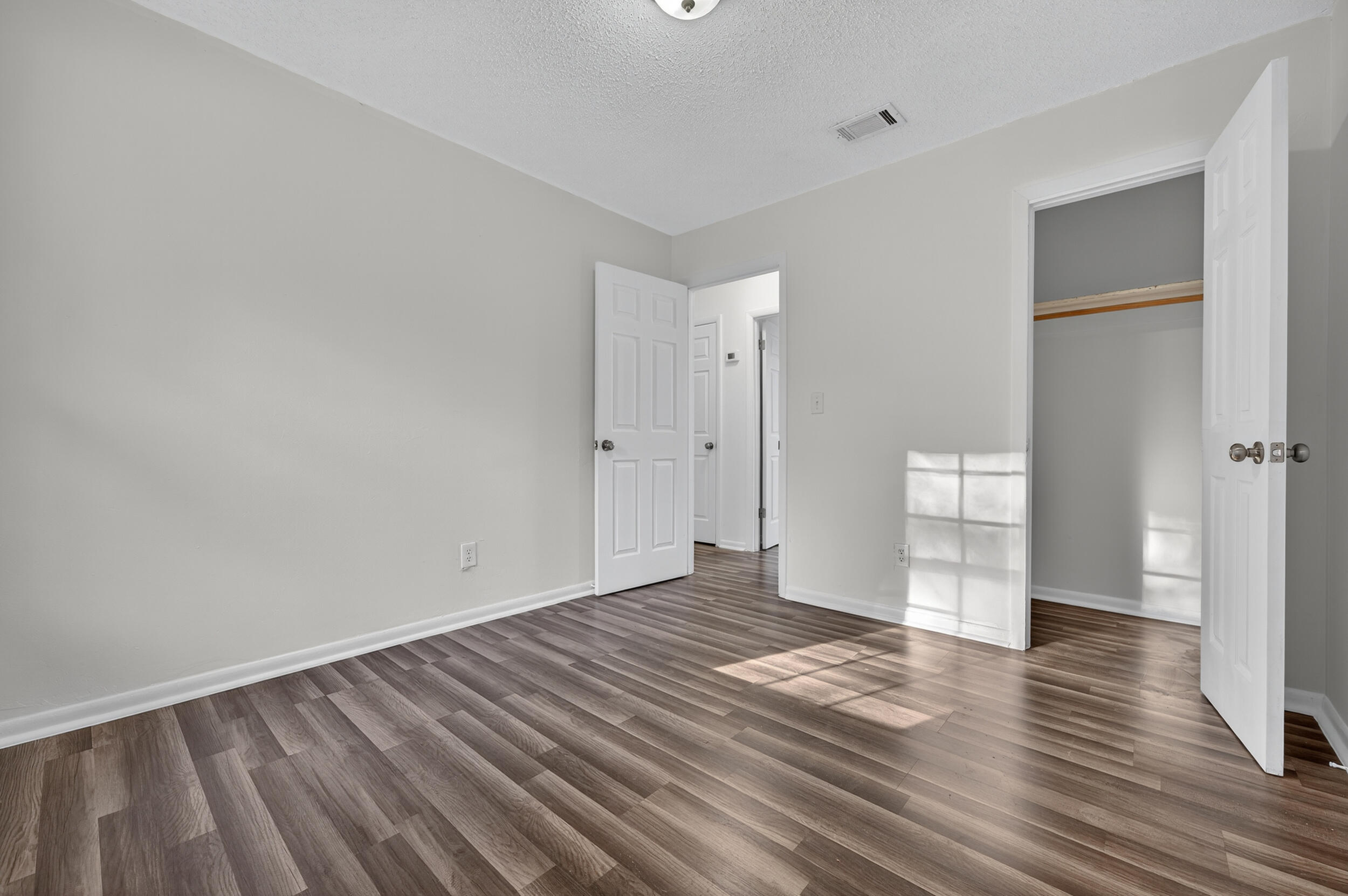 552 Roberts Drive DeFuniak Springs, FL 32433 - Photo 32 of 40 wooden floor in an empty room