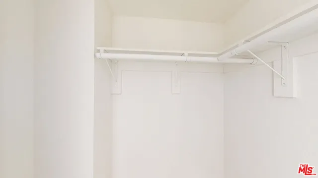 a bathroom with a shower and a toilet