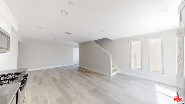 a view of a livingroom with wooden floor